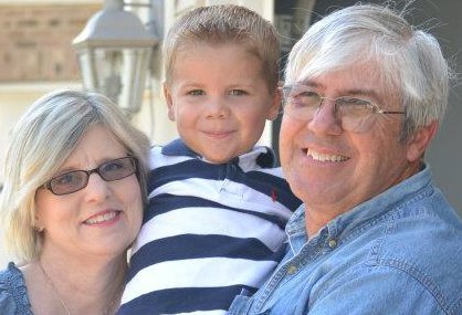 James Miller and Susan with grandkid 2012